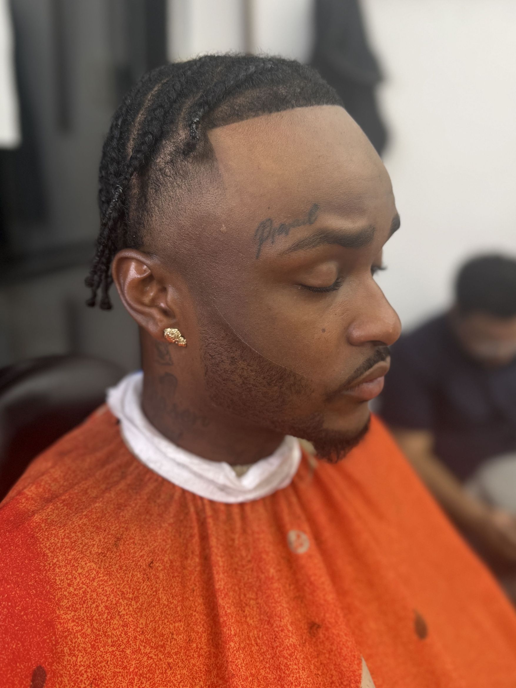Barber at work at JussXclusive Barbershop, 1000A Castle Hill Ave